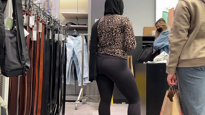 Filmed muslim hijab in the mall with tight leggings