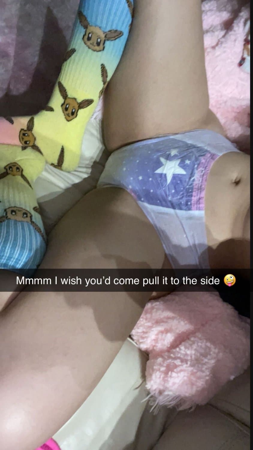 Cute tanned girl shows off her diapers and pull-ups