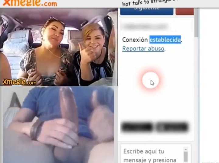 Three girls in a car having fun with a guy via video chat