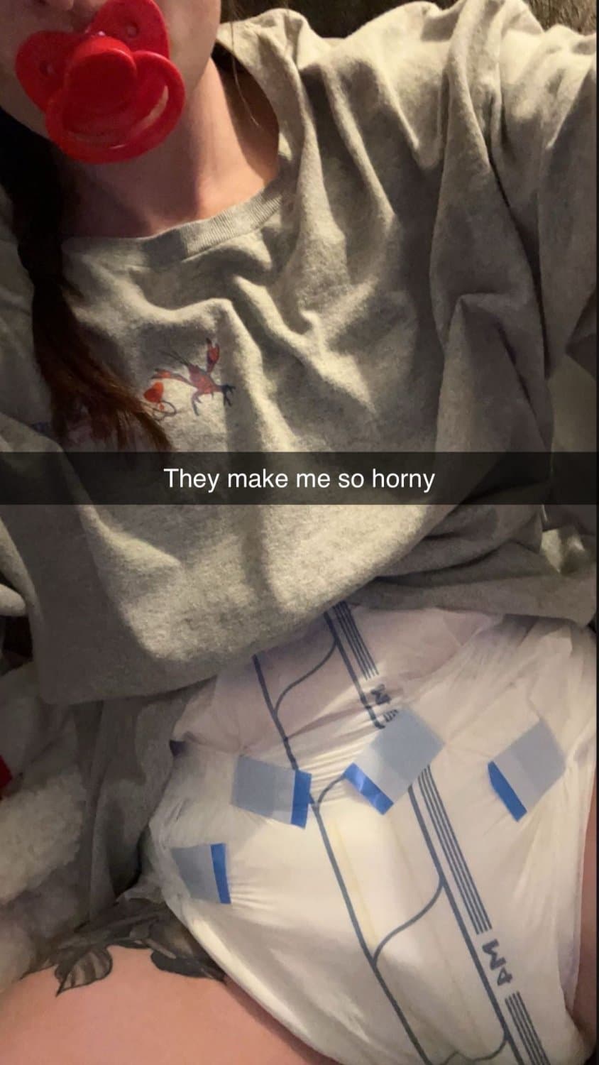 Cute tanned girl shows off her diapers and pull-ups