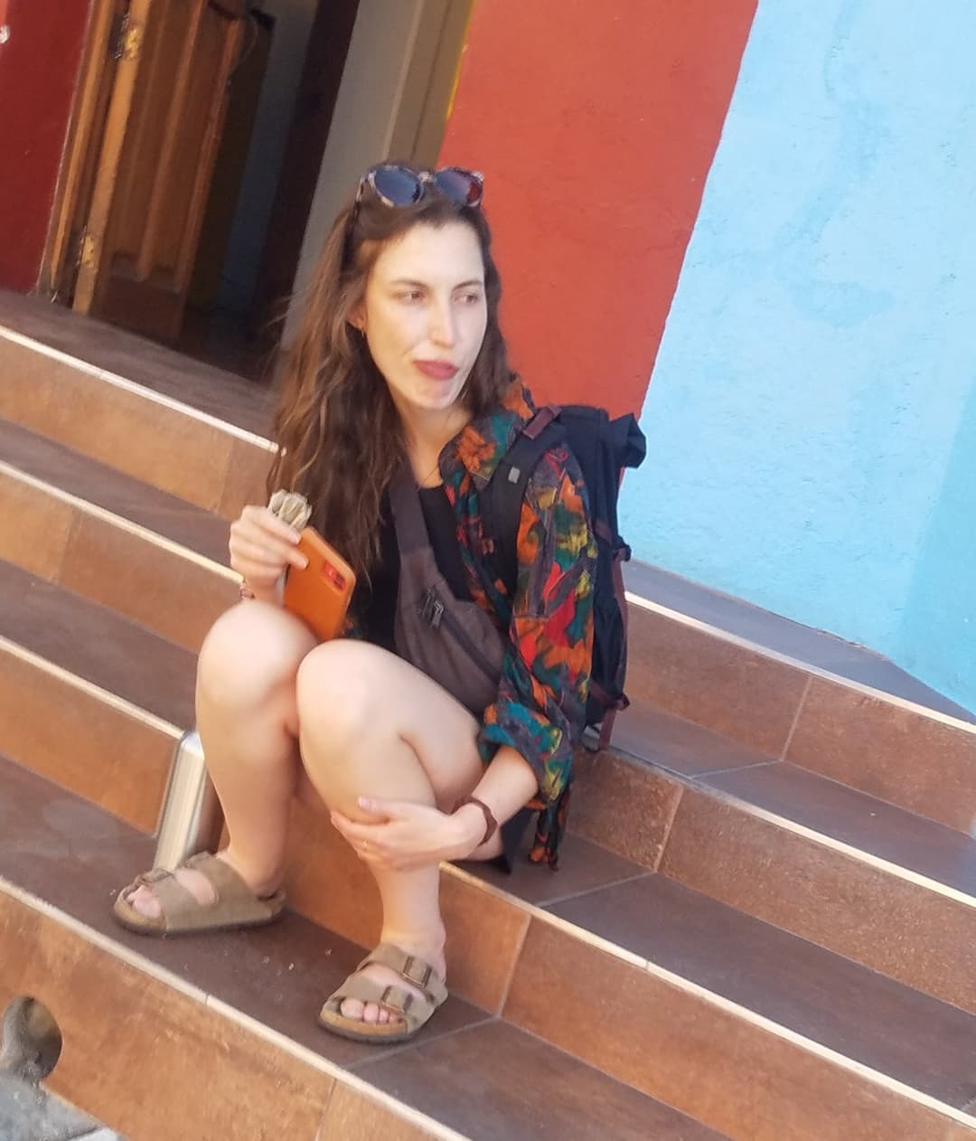 some girls sitting, showing legs and little else