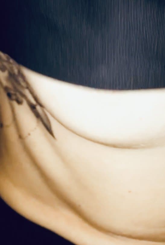 Petite English milf Perty tits takes off her top showing flower breast tattoo