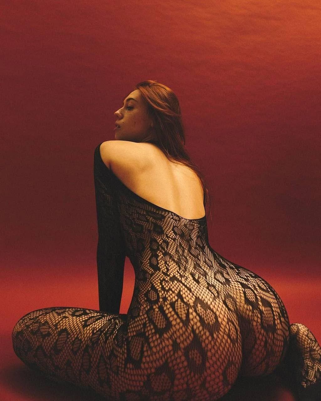 Sexy brunette in fishnets pantyhose