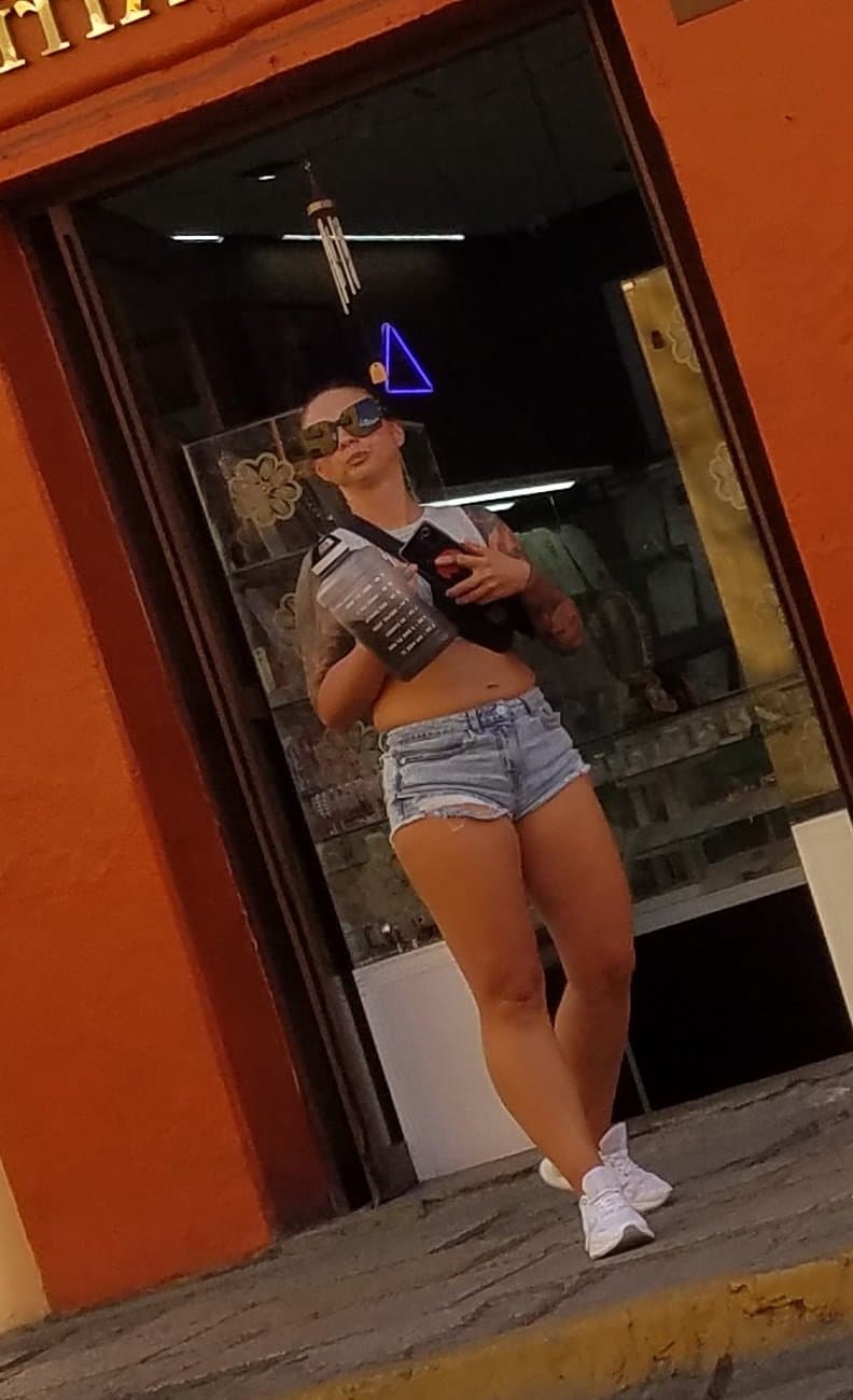 Nice legs and a little peach showing, shorts