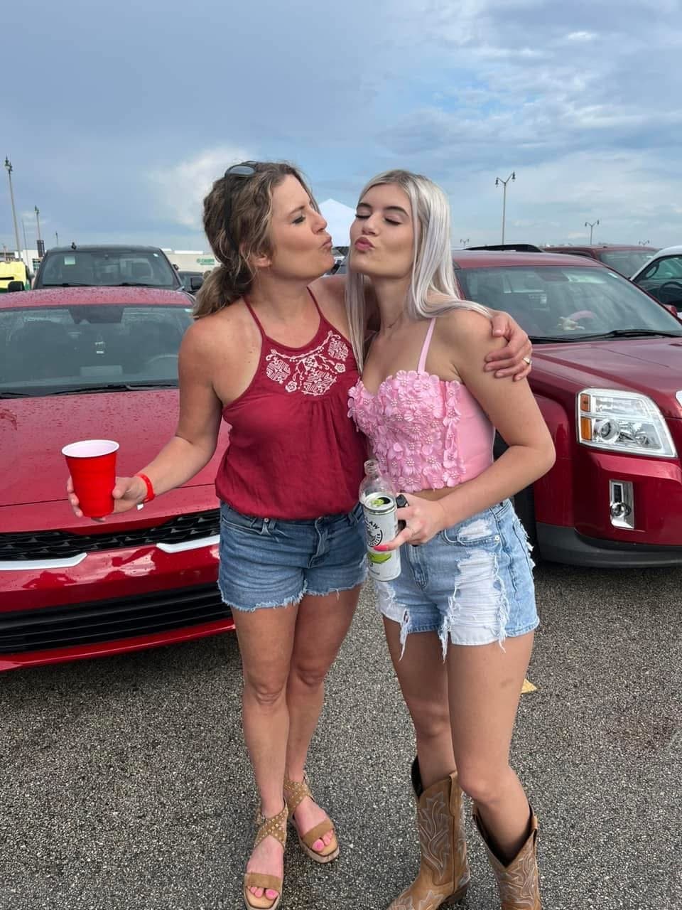 Hot Girls always go for the mean guys. Biker guy was making out with both of them as they strokedhim