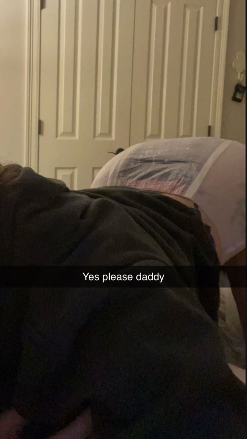 Cute tanned girl shows off her diapers and pull-ups