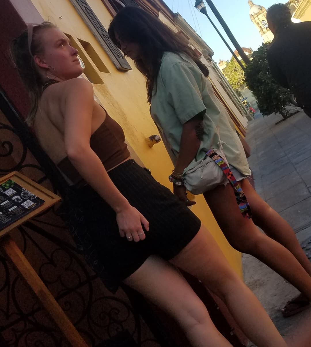 2 friends, blonde and brunette, in shorts, nice legs
