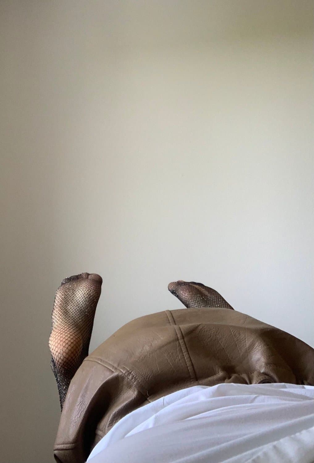 Kate Sissy Cl1412 showing her in leather skirt and fishnets