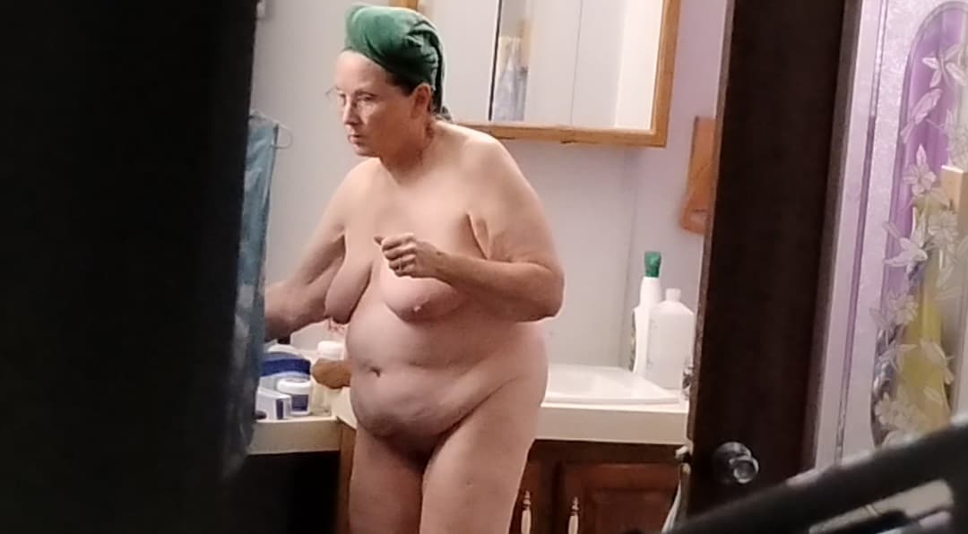 Peeking at my 60-year-old mother getting dressed after taking a shower.