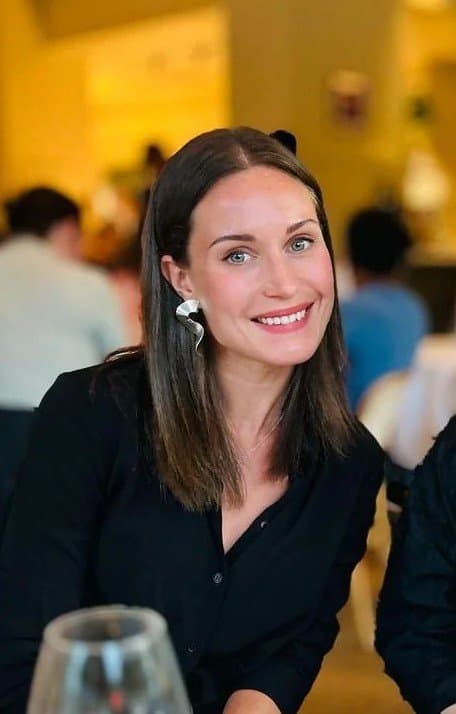 Finnish prime minister Sanna Marin.  Petite Elegant lady hinding a sex freak party chic within