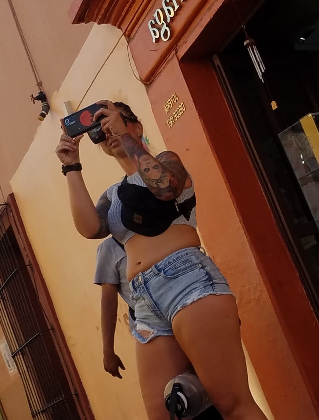 Nice legs and a little peach showing, shorts