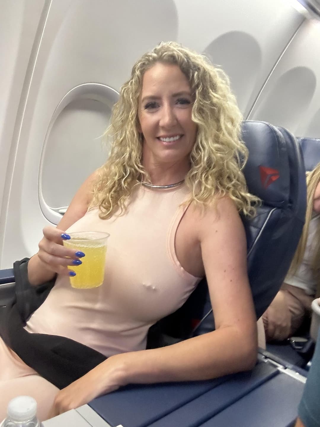 Some busty pierced braless woman ???