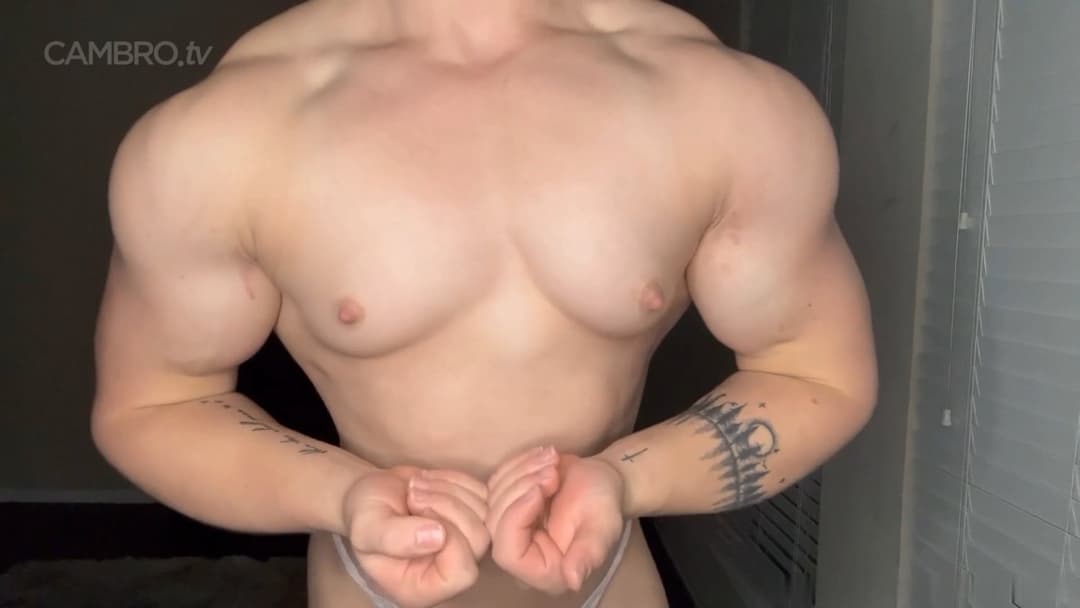 Muscular nudist performing a spermatic bodybuilding show