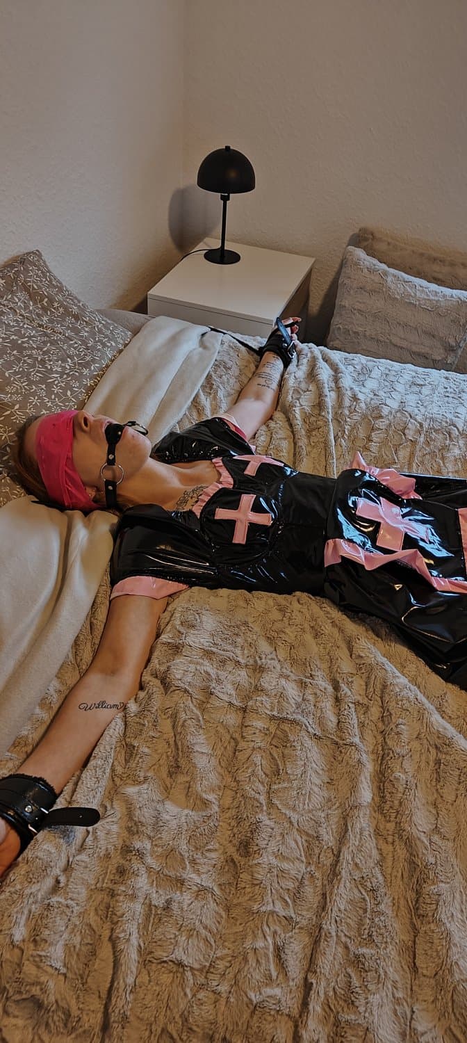 My sex slave in vinyl nurse costume getting ready to get fucked