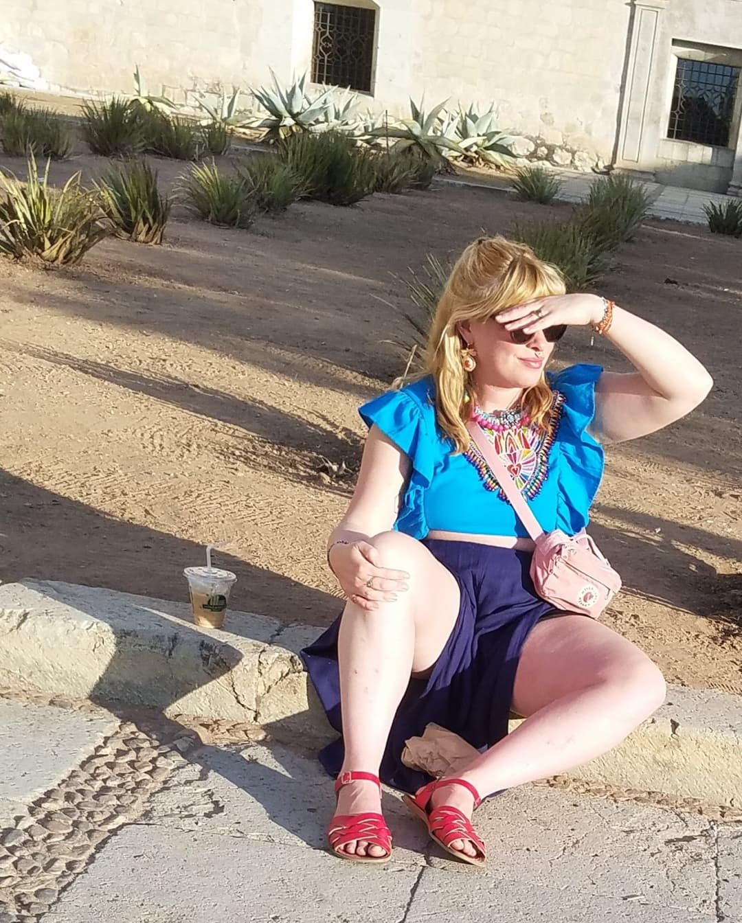 blonde sitting, legs open, nice thick legs