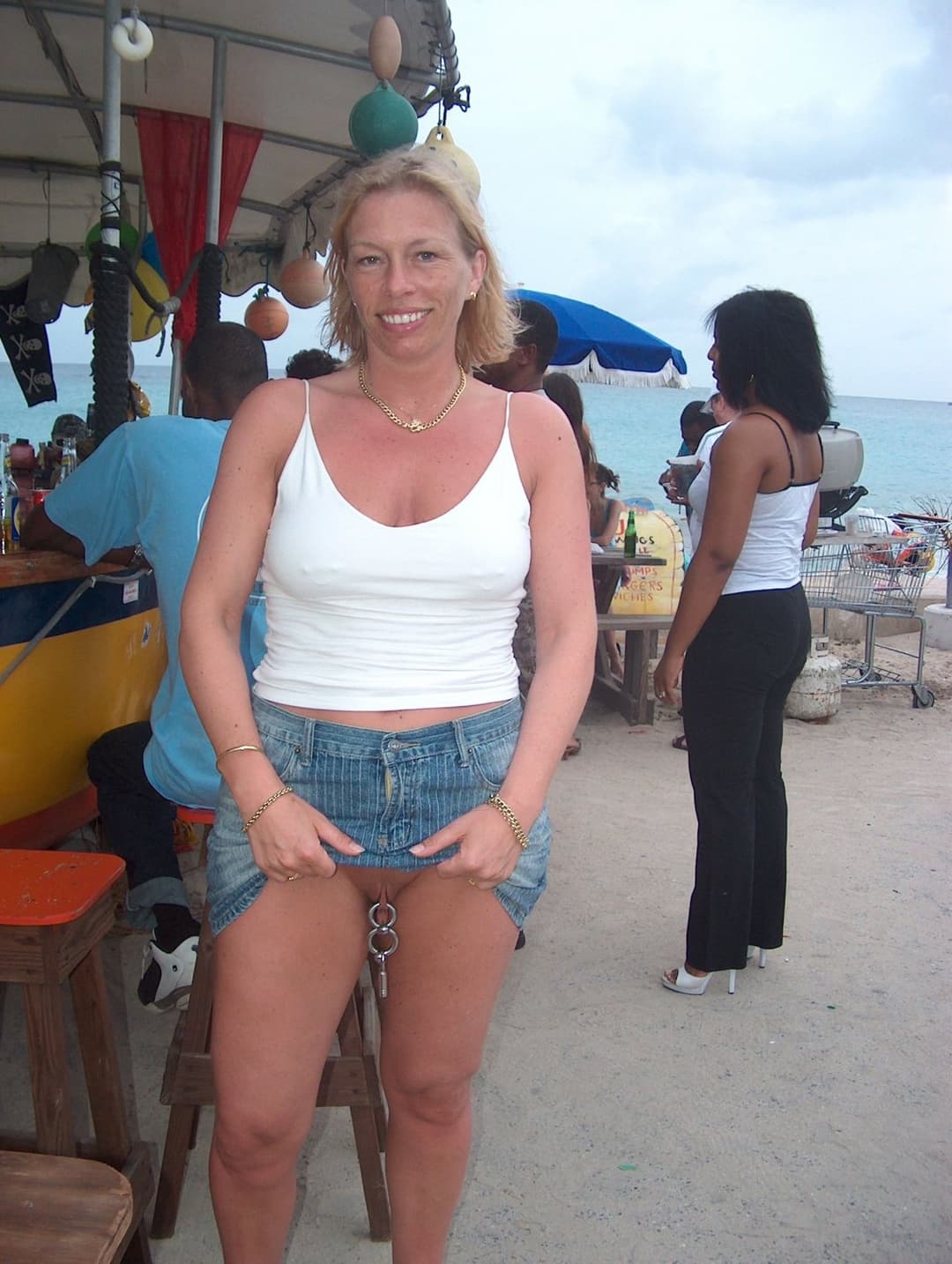 Amateur flasher with cunt piercings