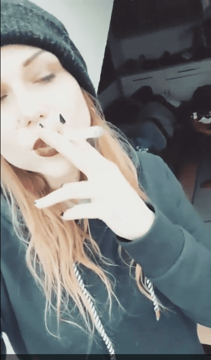 smoking hot emo hipster goth girl fucks the guys in the band. I love when women smile and smoke.