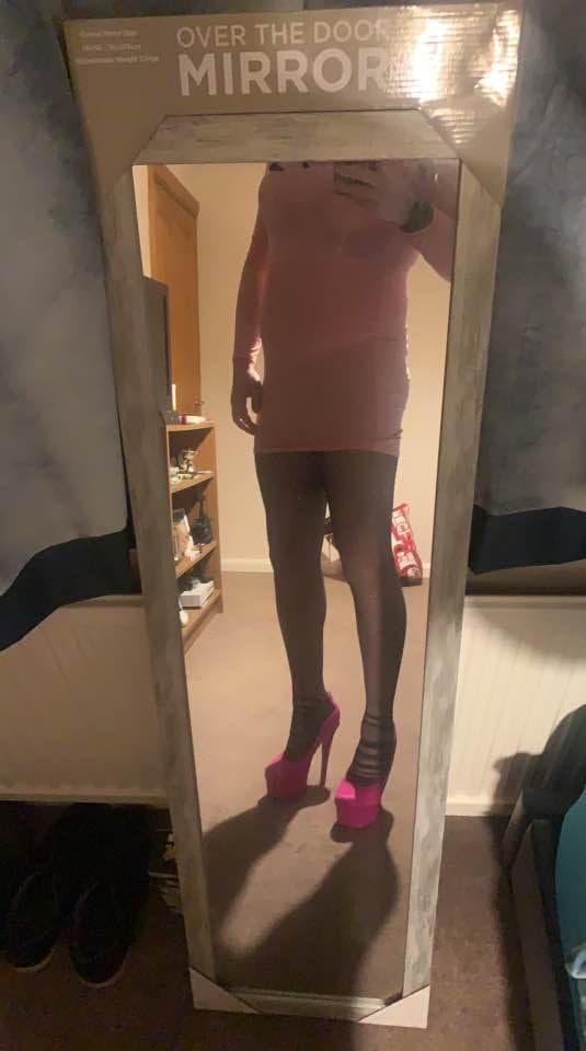 My obedient sissy posing for me behind his gfs back