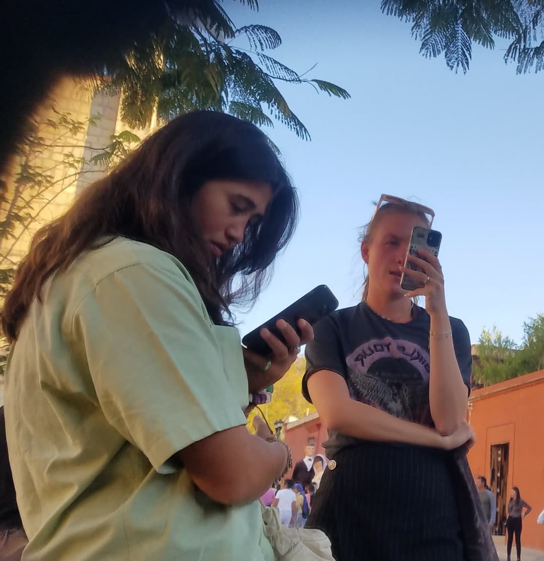 2 friends, blonde and brunette, in shorts, nice legs