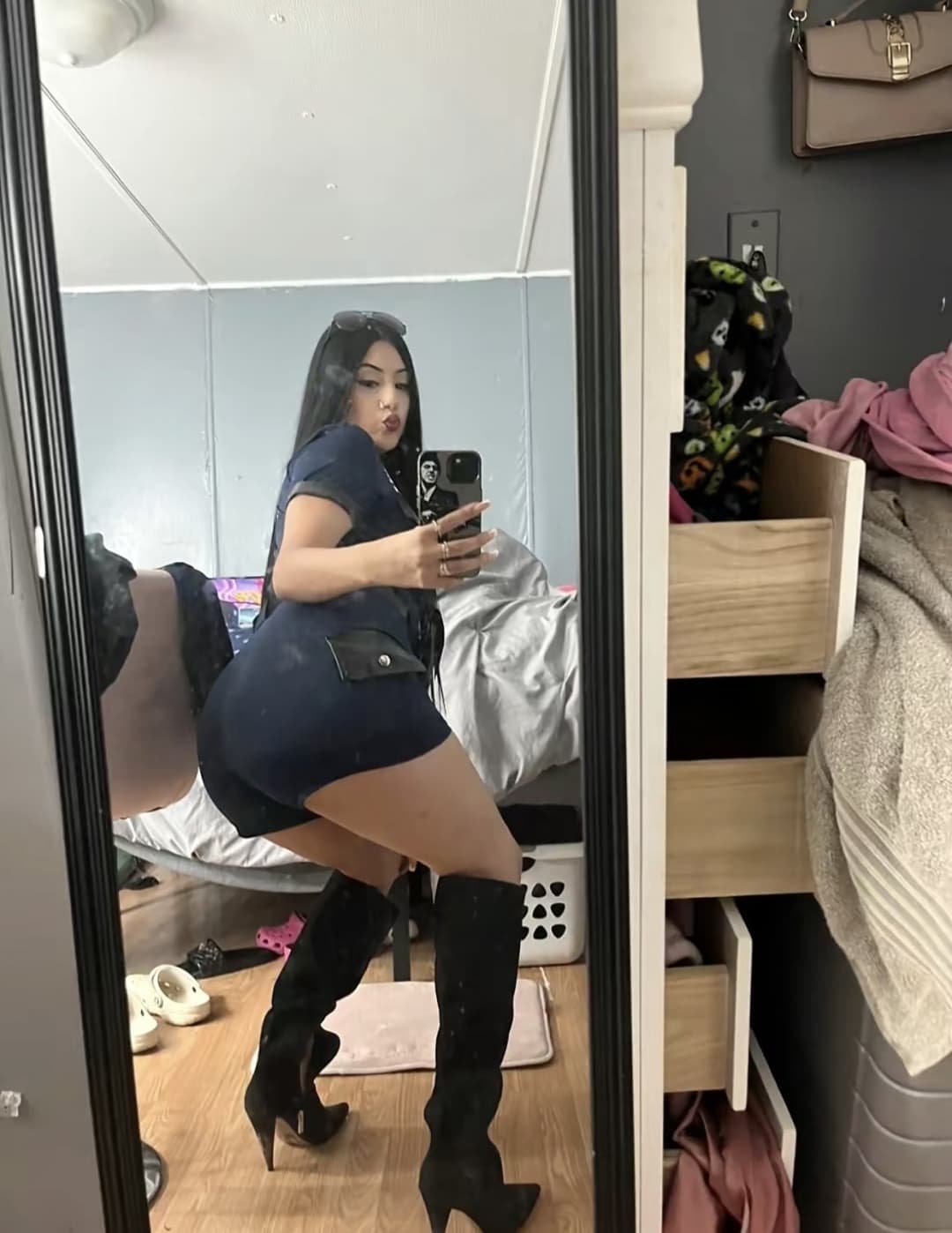 Sexy Latina showing off her costumes