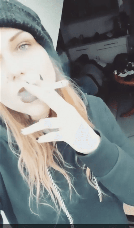 smoking hot emo hipster goth girl fucks the guys in the band. I love when women smile and smoke.