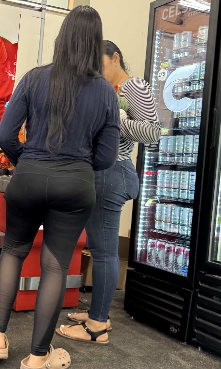 Mother in blue jeans  & Daughter in black tights.
