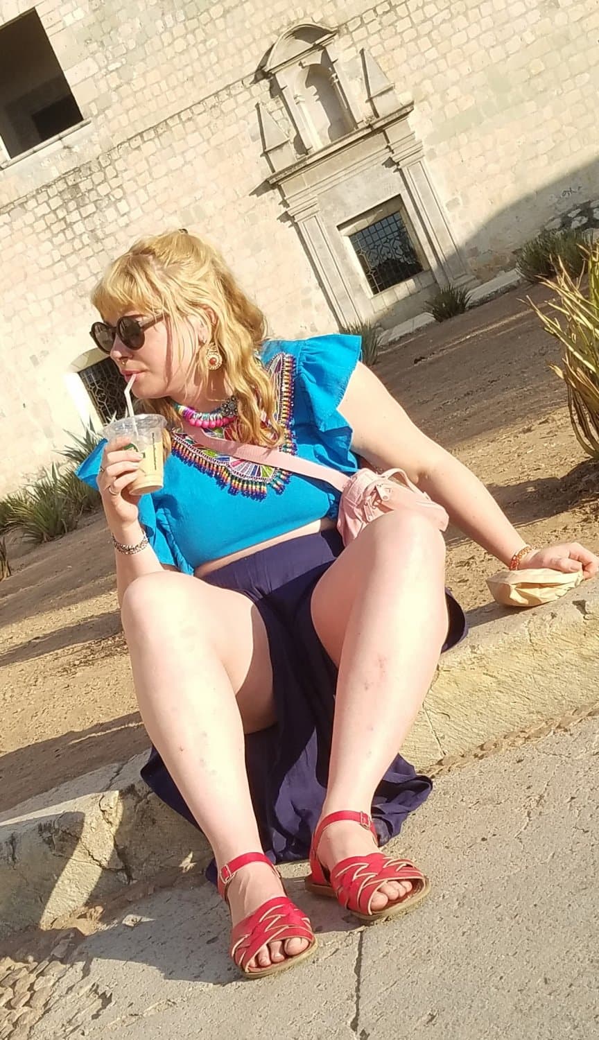 blonde sitting, legs open, nice thick legs