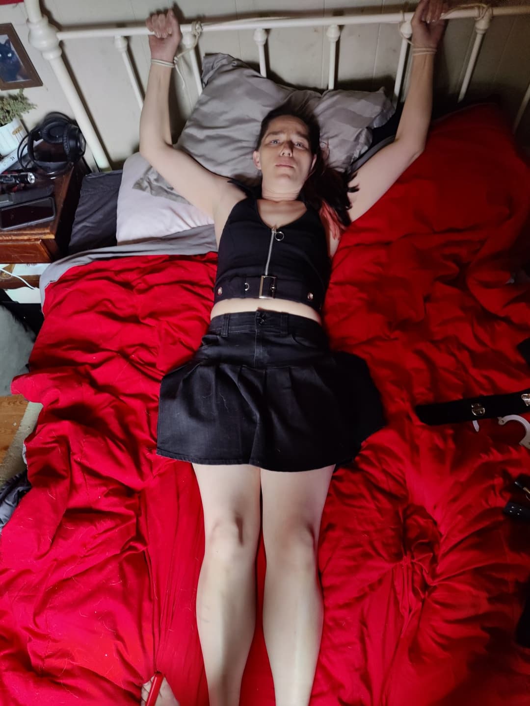 Wife tied to bed in miniskirt