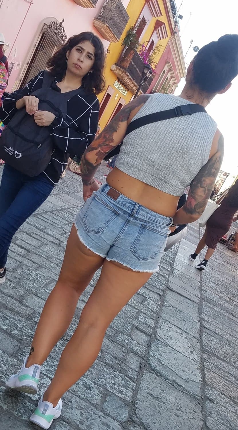 Nice legs and a little peach showing, shorts