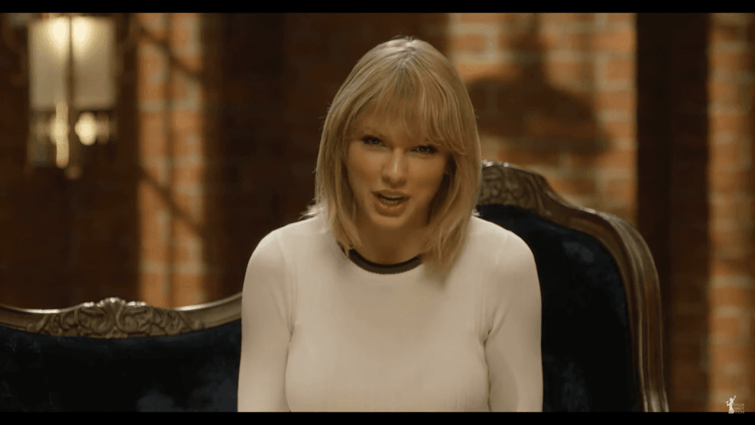 Taylor Swift tight white sweater, leather skirt, leather heels