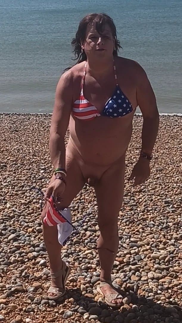 Click to view full size Bottoms off on Brighton nude beach