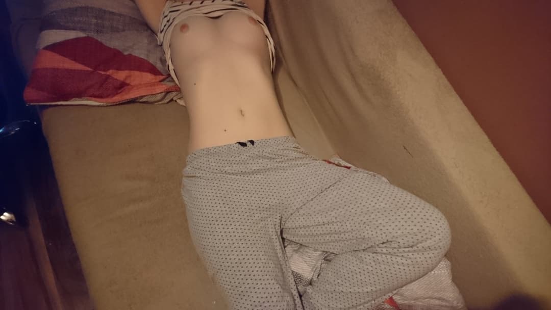 Young teen laying in bed