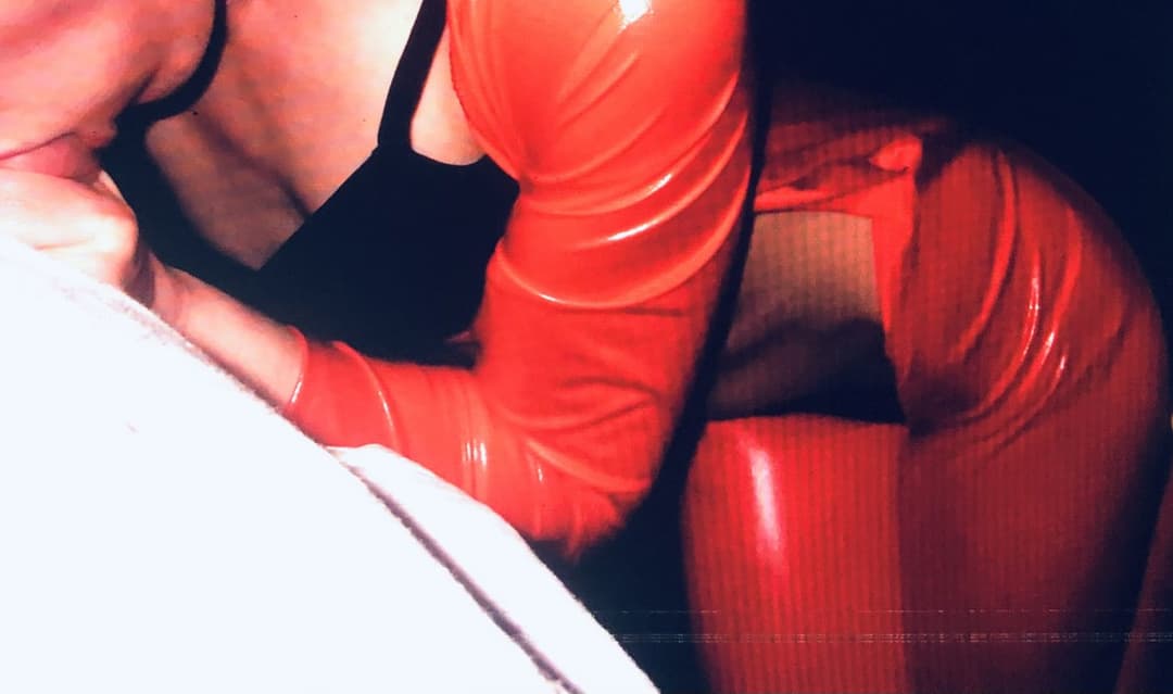 English milf in red pvc cat suit and black high heels  . uk milf in  Black lace panties pussy play