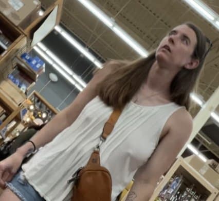 Click to view full size Bitch with no bra and big floppy tits at the store creep shots
