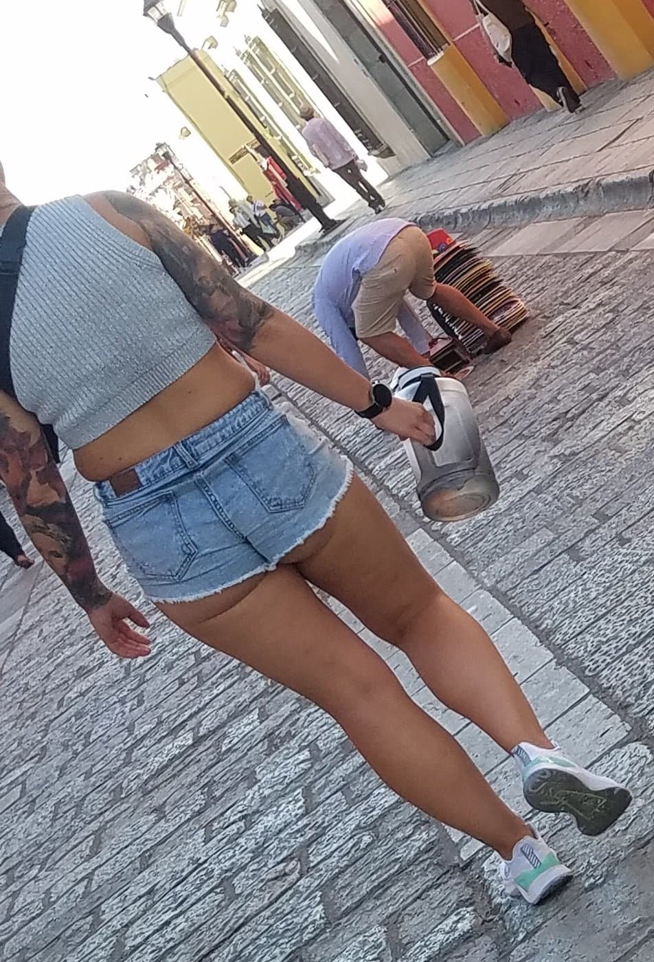 Nice legs and a little peach showing, shorts