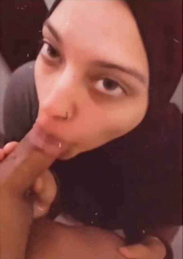 Hijab girl jerks off cock licks balls