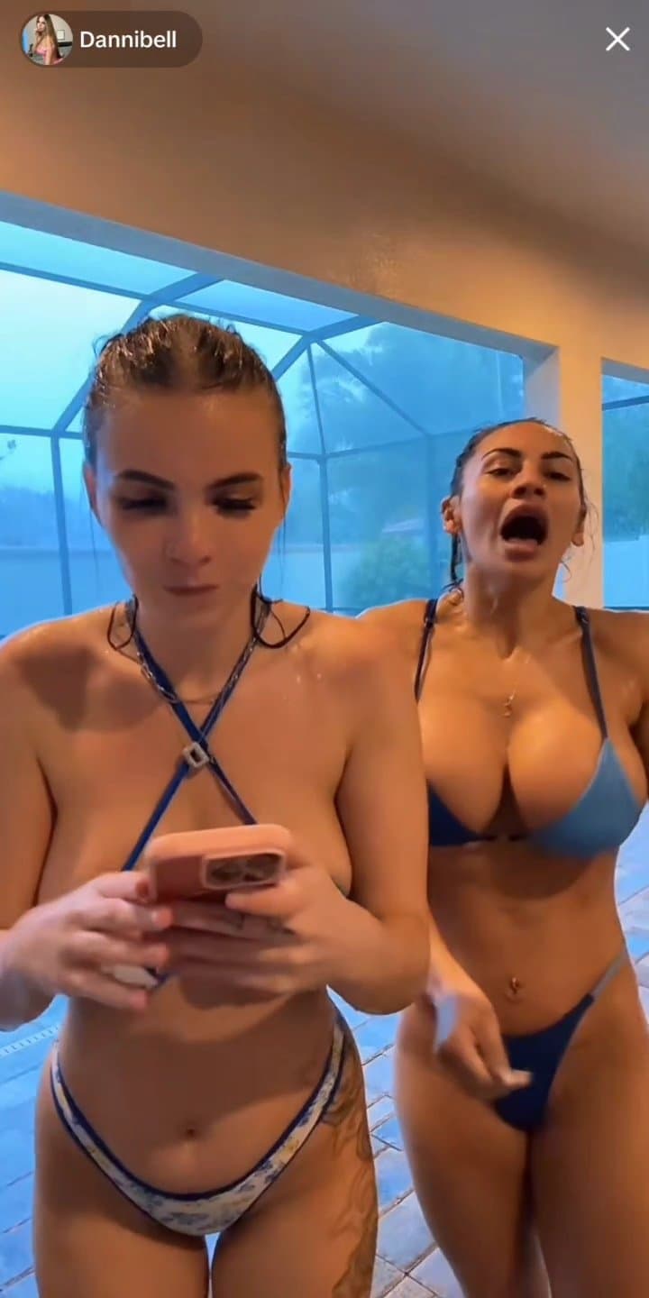 Wet girls in bikini with huge boobs jumping during hurricane