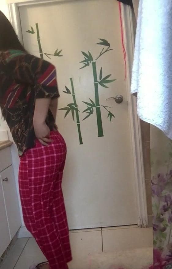 Filipina caught on hidden cam in bathroom