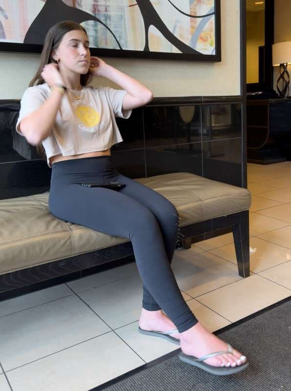 Brunette with white toes and black leggings creepshot