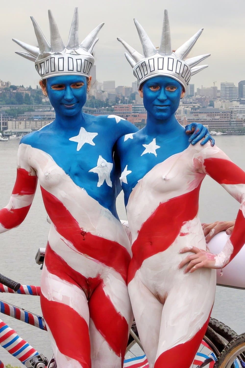 Nudist girls doing body paint in public