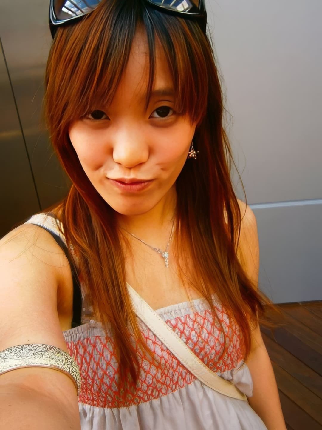 Cute HongKong slut revealing her boobs