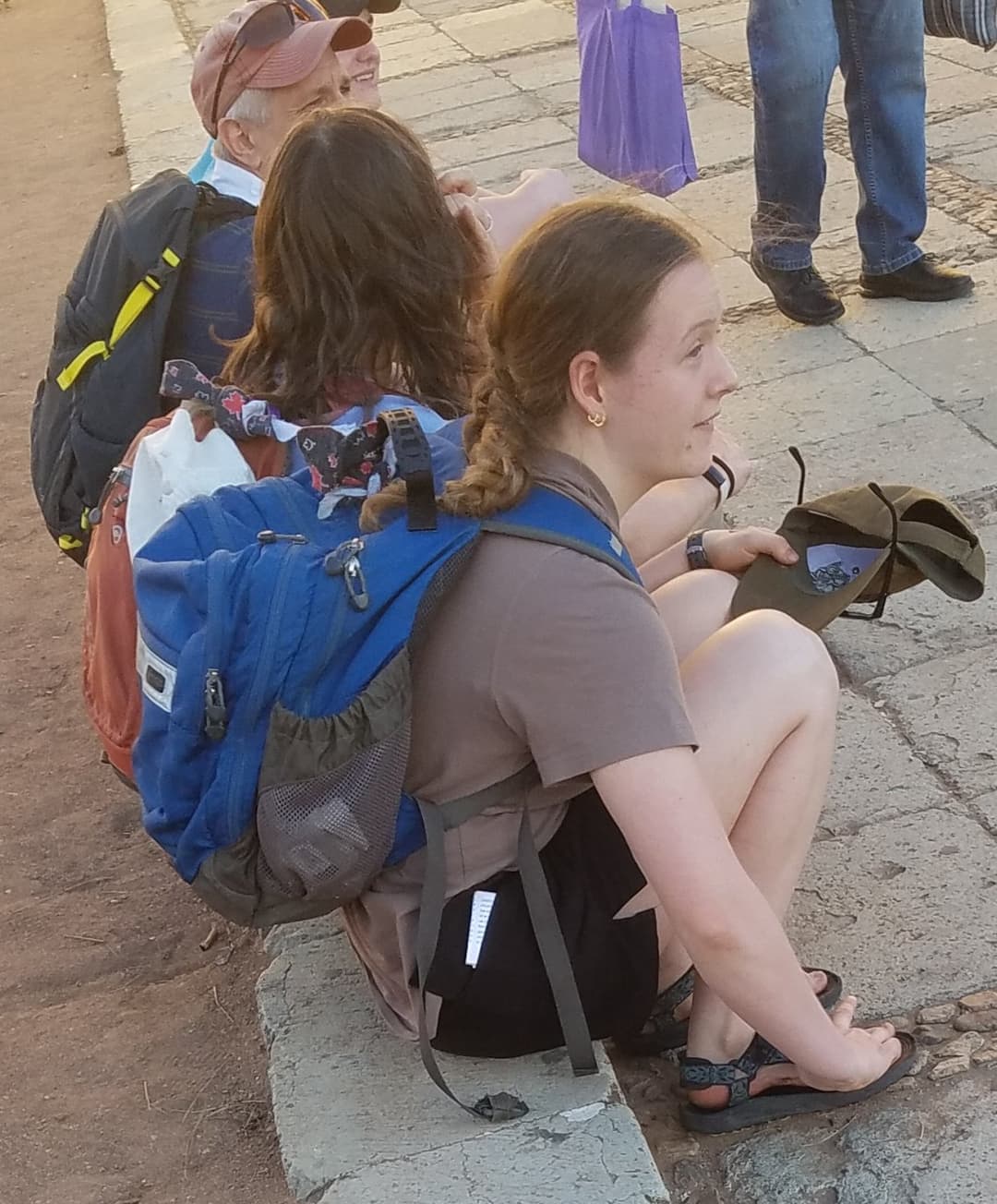 some girls sitting, showing legs and little else