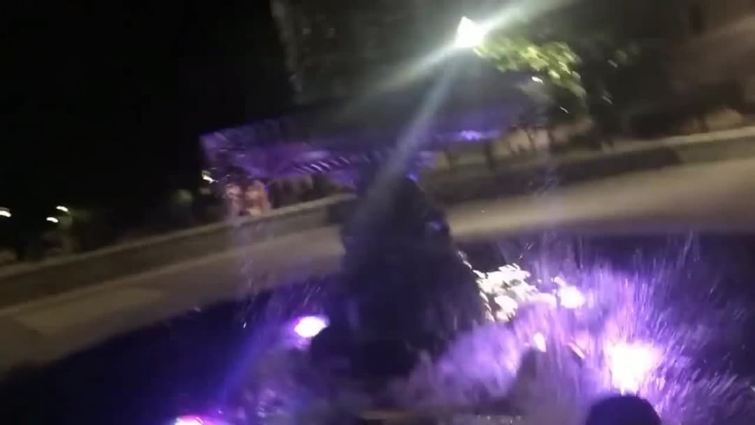 Girls Jump Into Fountain