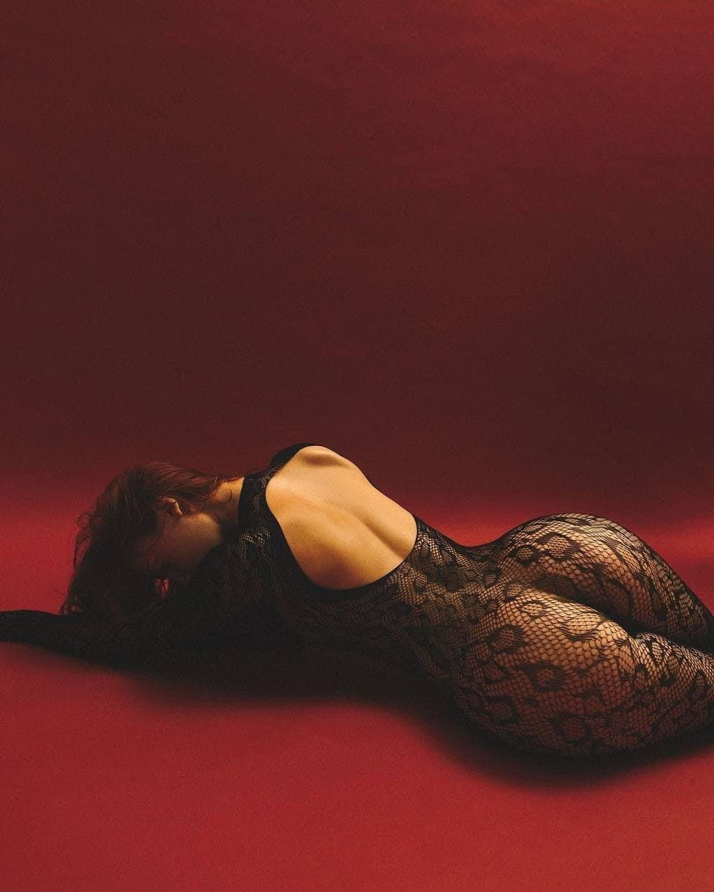 Sexy brunette in fishnets pantyhose