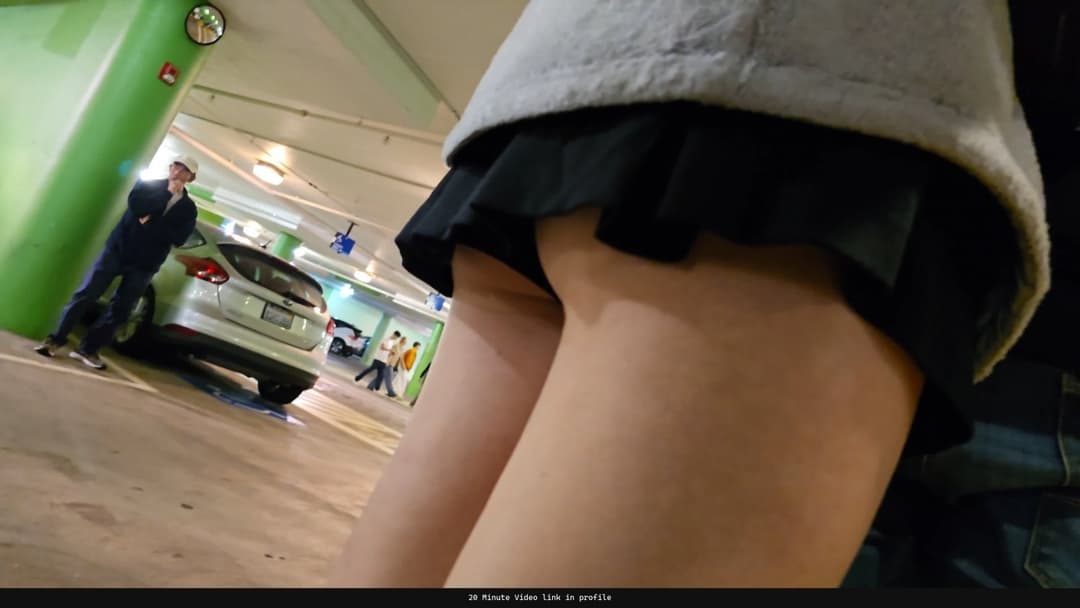 Caught my oblivious neighbor in the parking garage - her skirt is dangerously short!