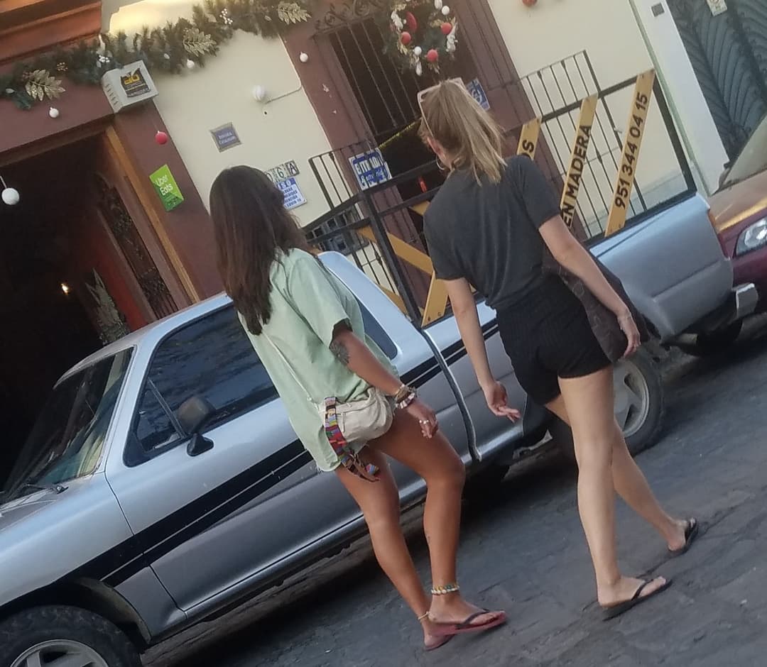 2 friends, blonde and brunette, in shorts, nice legs