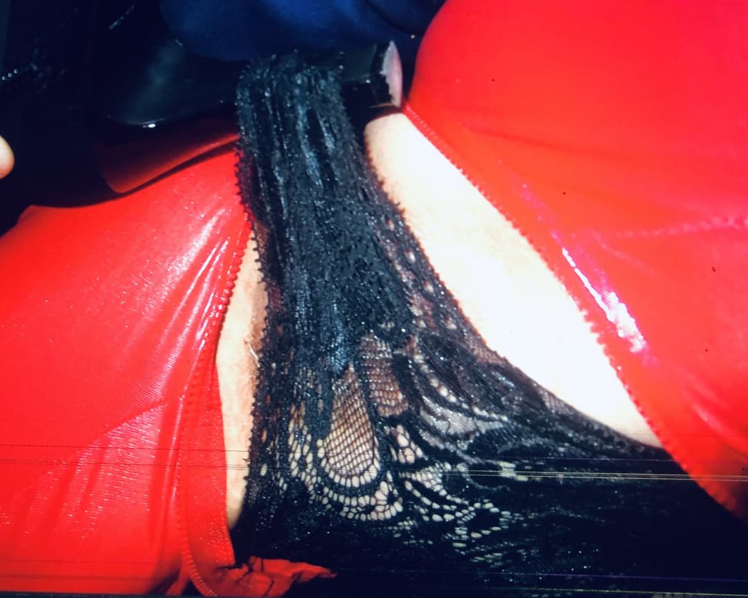 English biker milf strips again Red pvc and black panties  merry Christmas