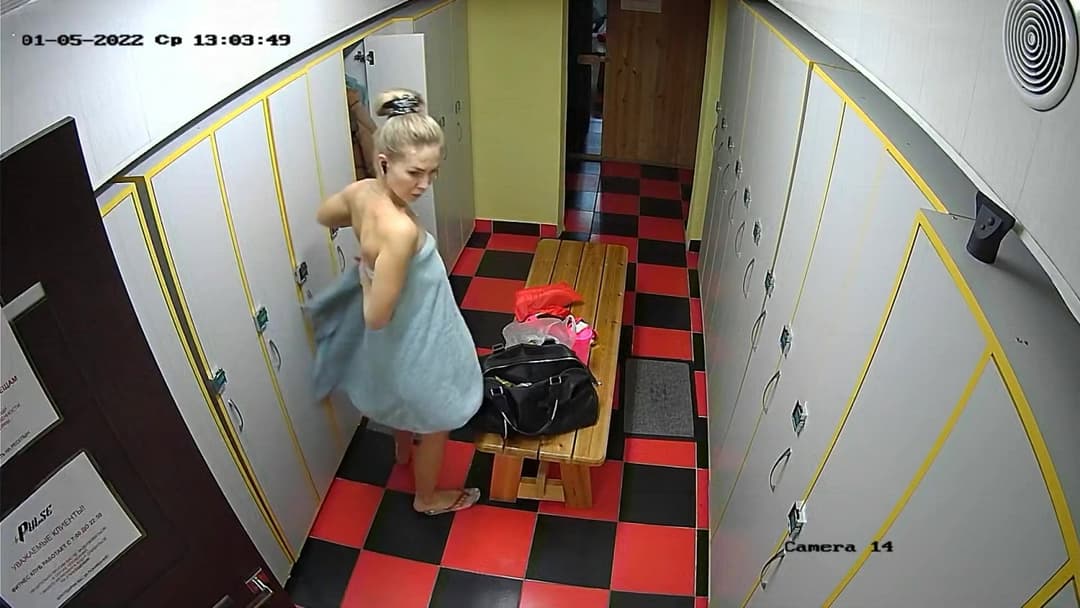 Woman trying to hide saggy little tits from her friend in locker room