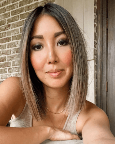 Rebecca Robertson Loflin.  The Asian in the family is a milf Christian whore working on a mom bod