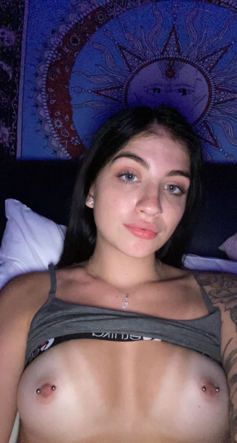 Sexy brunette with tattoos and pierced nipples